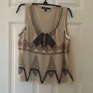 Embellished top with beautiful sequence and beading detail. Size large.
